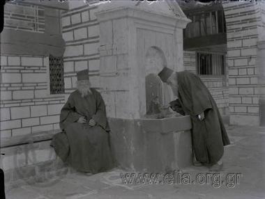 Excursion of the Travel Club to Mt. Athos 28/6-2/7. Vatopedi Μonastery. Two monks at the spring