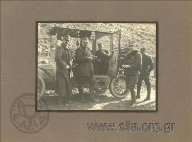 Artillery Colonel Leonidas Paraskevopoulos and officers having a meal by a car