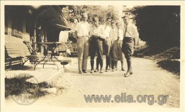 Stefanos G. Streit with a company of young men in the street of a European town.