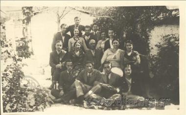 Stefanos G. Streit in a company of men and women in a garden.