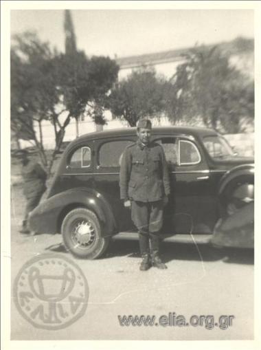 Stefanos G. Streit as a soldier next to a car.