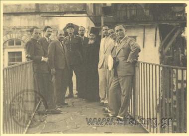 Stefanos G. Streit in a company of men on the balcony of a monastery.