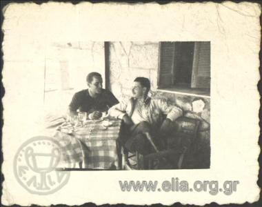Stefanos G. Streit and a man at a taverna.