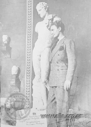 Portrait of a young man next to the statue of Hermes of Praxiteles.