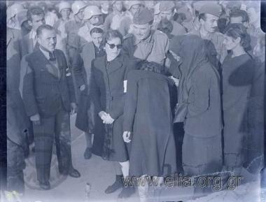 General  Mantakas of ELAS (Greek Popular Liberation Army) and Captain Nestoras, at the Kaisariani cemetary, giving their condolences to the women who lost their men during the fighting.