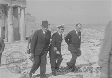 Liberation of the country, celebrations, speeches, parades, the hoisting of the Greek  flag on top of the Acropolis by G. Papandreou's 1st government. 