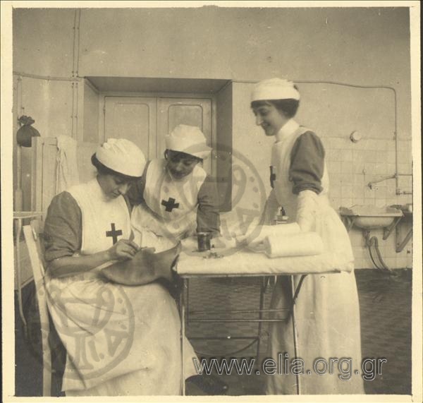 Three sister nurses in a hospital ward.