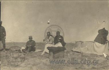 Sofia Deligeorgi with another nurse rests in a tent.