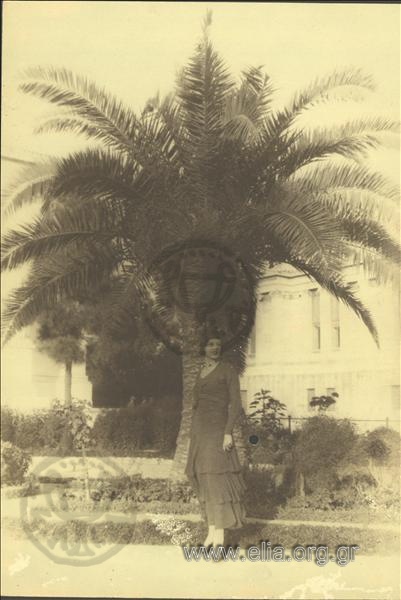 Woman at a palm-tree