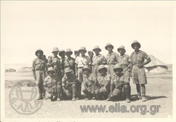 Servicemen in a British summer campaign uniform (Greek s?) in a settlement.
