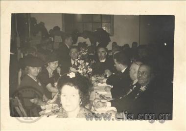 Group portrait during a meal.