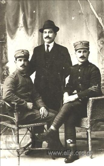 Portrait of a man with two soldiers