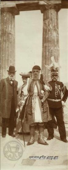 Officials, a fighter of the Revolution (?) wearing foustanella (Greek kilt) and a staff officer Lieutenant-Colonel attending an official ceremony at an ancient temple, perhaps in Eleusis