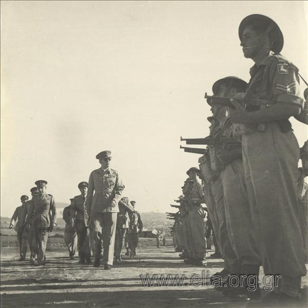 Escorted by Field Marshal Alexandros Papagos, King Pavlos I is reviewing the military forces during a visit to the XV Division