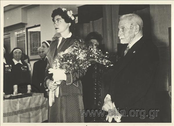 Honorary President of the Greek Red Cross Ioannis Athanasakis and Queen Frederiki at the ceremony for the conferment of diplomas to nurses of the Greek Red Cross