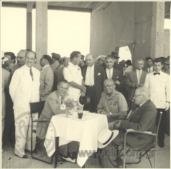 King Pavlos I on an official occasion. Standing on the left, Prodromos Athanasiadis-Bodosakis
