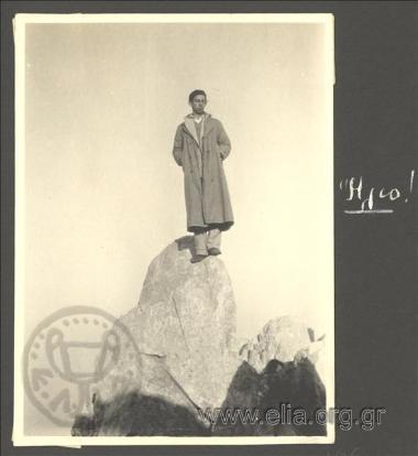 Andreas standing on a rock at the top of Mt. Athos. Journey to Mt. Athos
