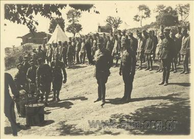 General  Leonidas Paraskevopoulos observing the operation of the soldiers' mess.
