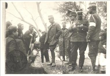 Crown Prince Konstantinos talking with country folks in the presence of his staff officers (including Victor Dousmanis)