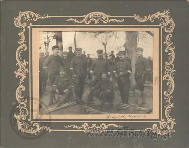 Greek  non-commisiond officers (Sappers?) by their paraphernalia - shovels and pickaxes. In the distance, a section of a settlement. The Balkan Wars