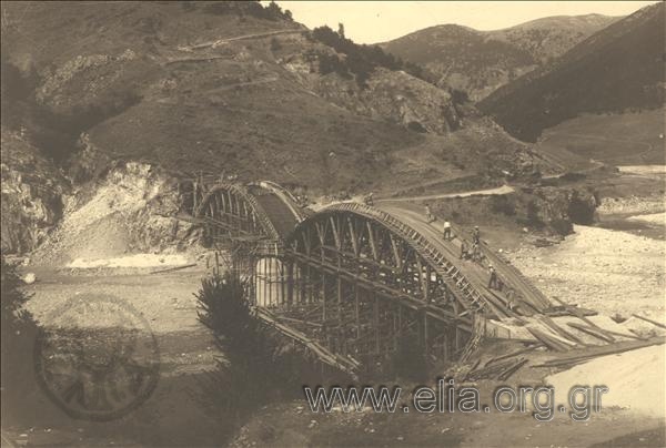 The construction of the bridge at Nestos river. The crew of labourers works on the stringer of the bridge.