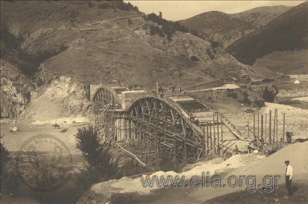 The construction of the bridge at Nestos river. The crew of labourers works on the stringer of the bridge.