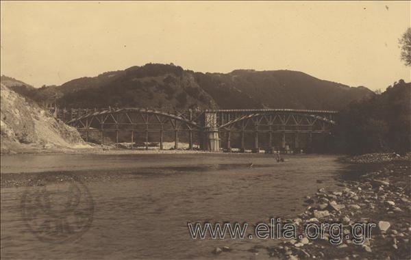 The construction of a bridge at Nestos river. View of the bridge from the river watercourse. The wooden frames of decks stand out