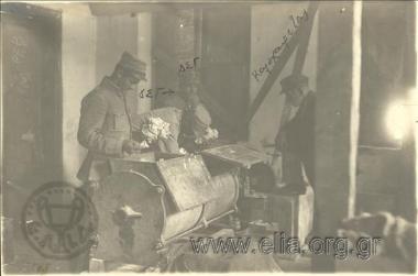 Pasta-making workshop of the Greek  Army housed at a former Armenian cinema.  Dimitris Georgakopoulos, ofiicer responsible for the financial and technical study and installation of the workshop, and Kalochairetas, father of the owner