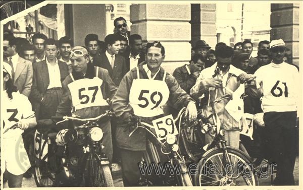Motorcycle riders and people at the cycling races from Athens to Patras.