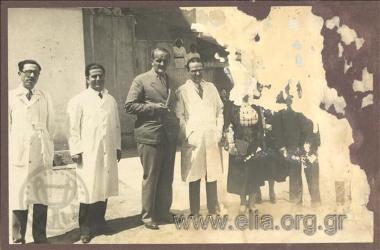 Mayor of Athens Kostas Kotzias and Lina, Prime Minister  Panagis Tsaldaris' wife, visiting an infant care centre