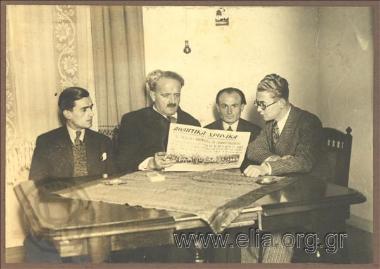 Mayor of Athens Kostas Kotzias and associates at a meeting for the Federation of the Independent. Kotzias reading 