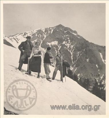 Eastern excursion. Company on a snowy slope of a mountain