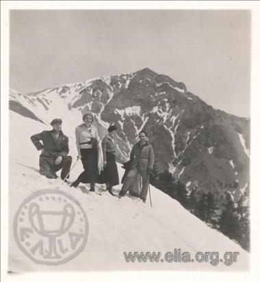 Eastern excursion. Company on a snowy slope of a mountain
