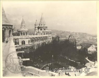 A complex of buildings with small towers (Palace?)