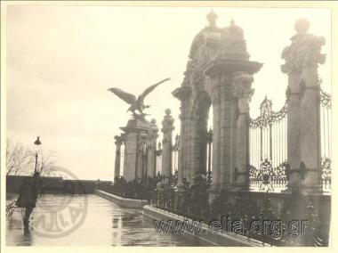 Fencing and entrance of the precinct with sculpture decoration.