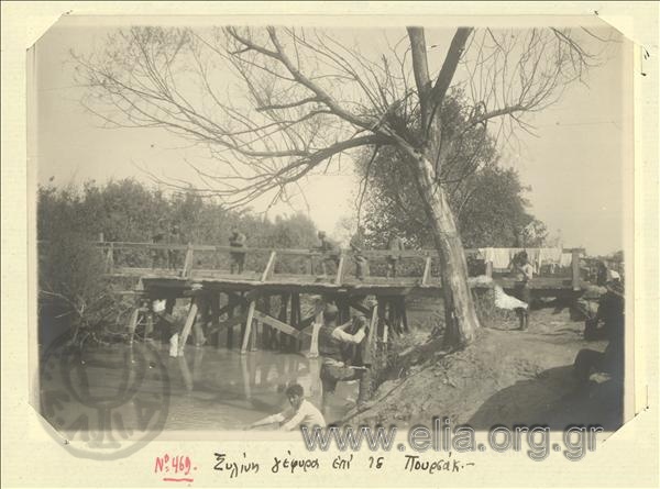 Asia Minor campaign, Greek  soldiers wash themselves near the wooden bridge of the Pursak river.