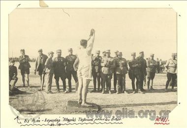 Asia Minor campaign, the athlete Tsivoukas prepares to throw a discus in ahletic games at Afyon Karahisar. A team of Greek  offices takes a photograph of his.