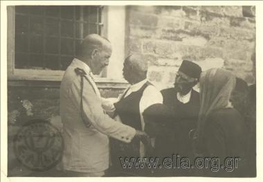 Asia Minor campaign, men and women hasten to greet King Konstantine during a visit of his.