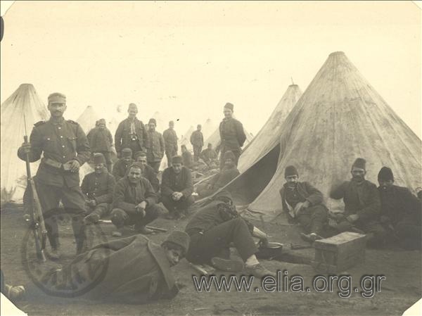 Balkan War I, Turkish prisoners in their tents guarded by Greek  soldiers.