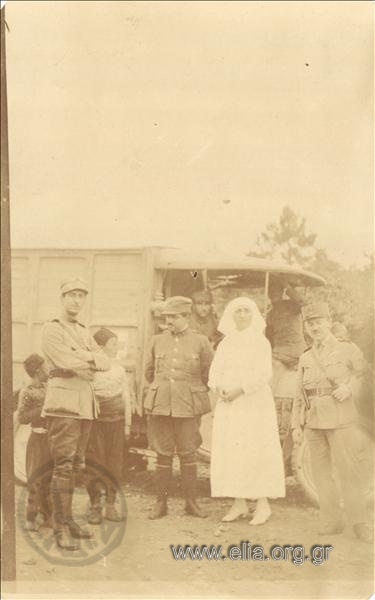 Asia Minor campaign, officers and nurse pose before an army truck.