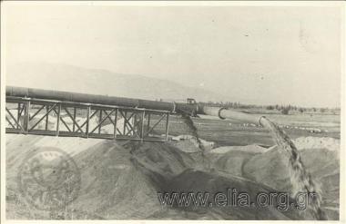 Drainage work at Lake Ioannina, reshaping of the peripheral canal around the lake: the far end of the piping where sand is separated from the water used for sending out muck scrapings from the lake. Dredging is carried out from vessel 