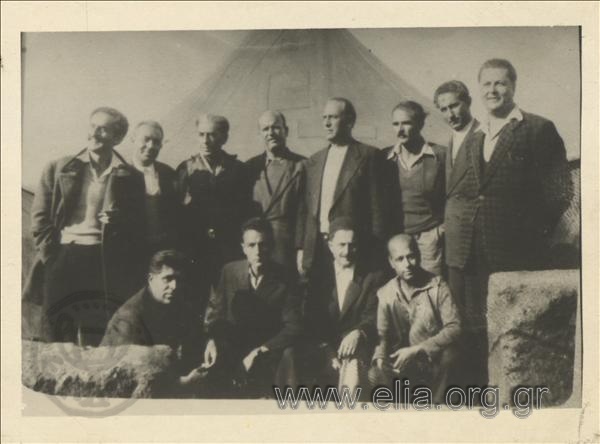 Exiles. Standing from left to right: Papaperiklis (second), Fotiadis (third), Hliou (fourth), Imvriotis (fifth), Iliadis (seventh). Agriculturalist Giannopoulos (below, third from the left)