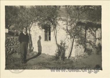 Dimitris Fotiadis outside the house he lived in exile