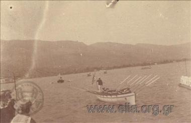Boats of the Greek  navy battleships approach the deck