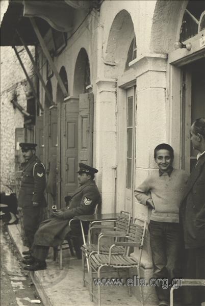 Gendarmes at the tables of the Theocharis café-restaurant.