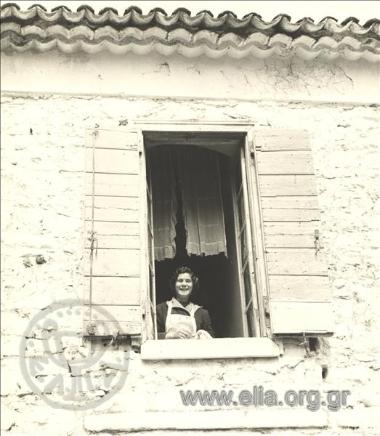 Woman by the window at home