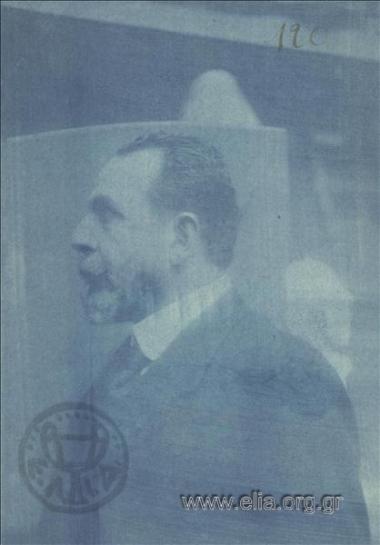 Man posing for sculptor Kostas Dimitriadis in his workshop