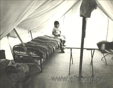 Interior view of a tent in a refugee camp.