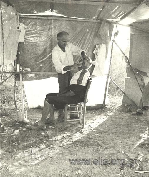 Barber shop at a refugee camp.