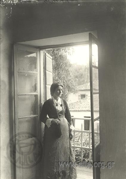 Portrait of a woman on balcony.